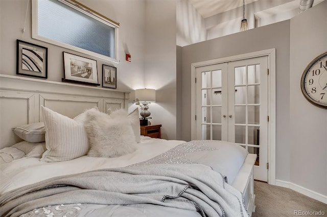 carpeted bedroom with french doors and a closet