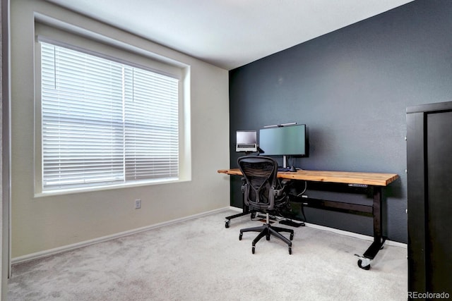 carpeted office featuring plenty of natural light and baseboards