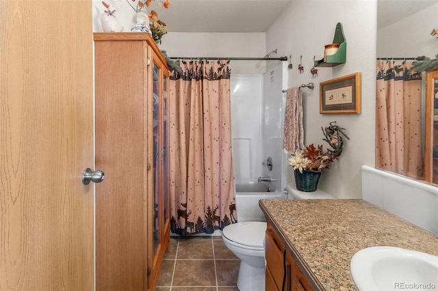 full bathroom featuring vanity, toilet, tile patterned flooring, and shower / bath combo