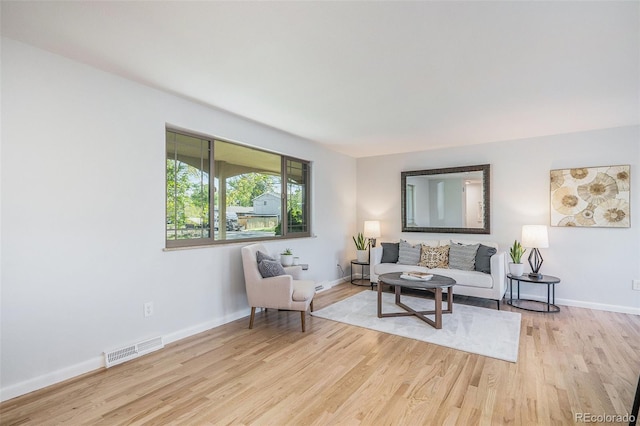 9345 W Iowa Pl, Lakewood, CO 80232 - living area with light wood finished floors and baseboards