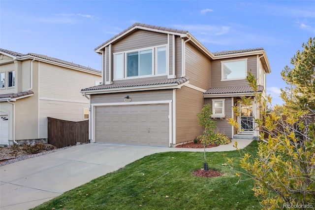 front of property with a front lawn and a garage