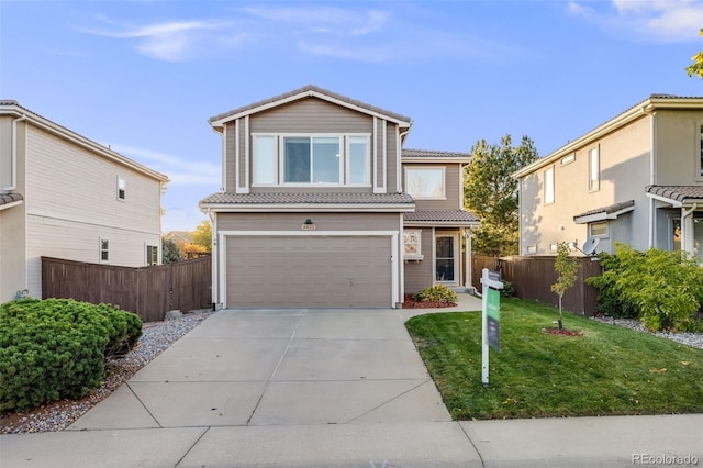 view of front property featuring a garage and a front lawn