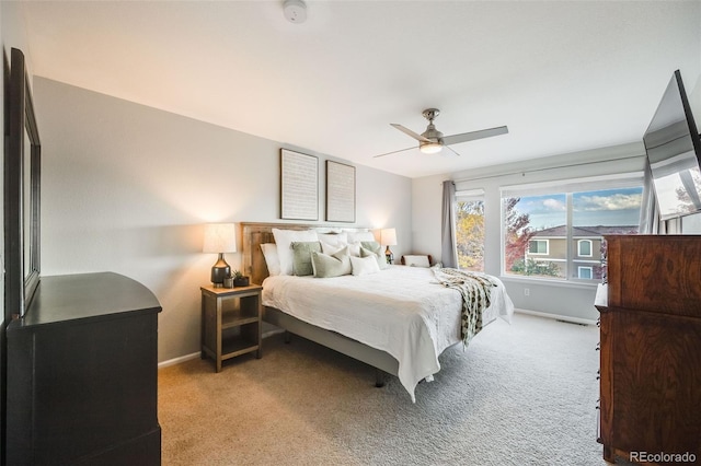 carpeted bedroom featuring ceiling fan