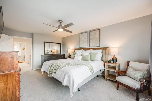 bedroom featuring light colored carpet and ceiling fan