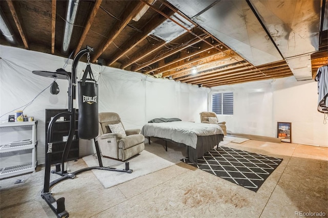 bedroom featuring concrete floors