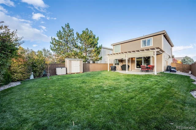 back of property with a patio, a shed, and a lawn