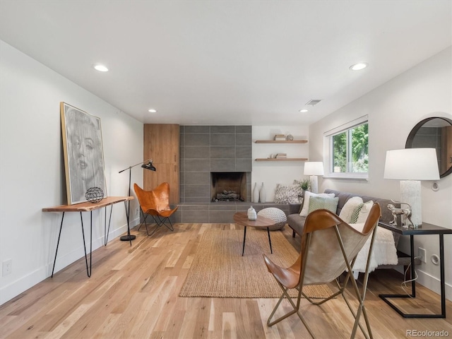 11569 W 27th Ave, Lakewood, CO 80215 - living room with light wood-type flooring, recessed lighting, a fireplace, and baseboards