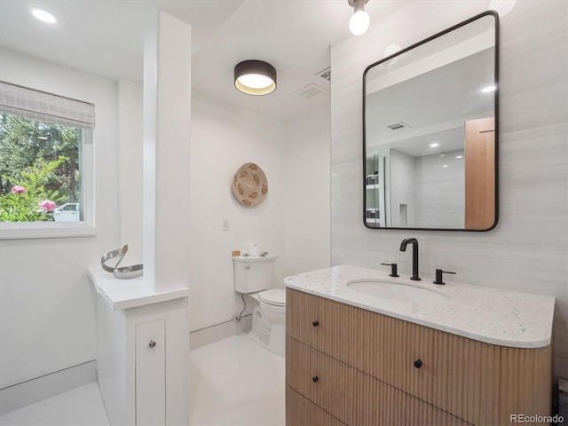 11569 W 27th Ave, Lakewood, CO 80215 - bathroom featuring toilet and vanity
