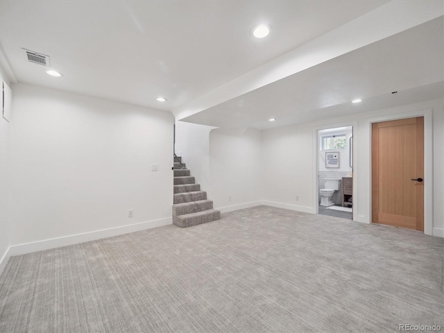 11569 W 27th Ave, Lakewood, CO 80215 - basement featuring stairs, recessed lighting, carpet flooring, and baseboards