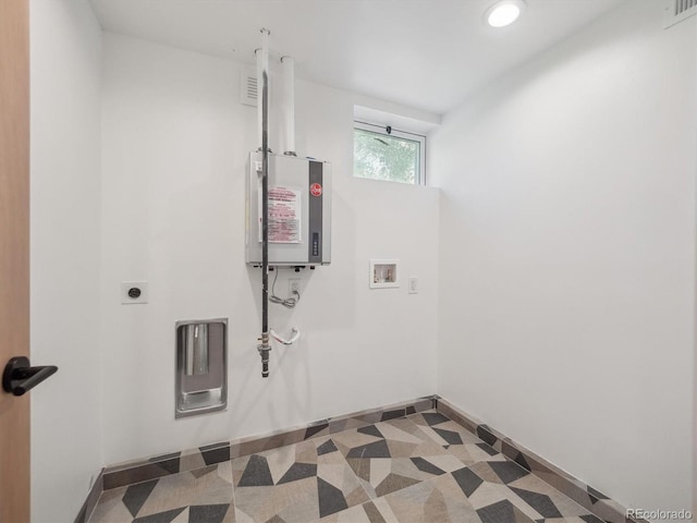 11569 W 27th Ave, Lakewood, CO 80215 - laundry room with washer hookup, water heater, recessed lighting, baseboards, and hookup for an electric dryer