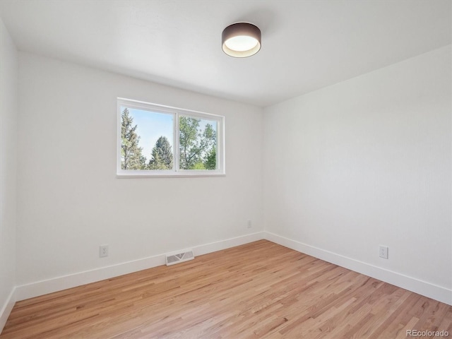 11569 W 27th Ave, Lakewood, CO 80215 - empty room featuring light wood-style floors and baseboards