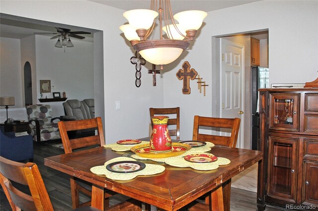 7824 S Zante Ct, Aurora, CO 80016 - dining room with a ceiling fan, arched walkways, wood finished floors, and a chandelier