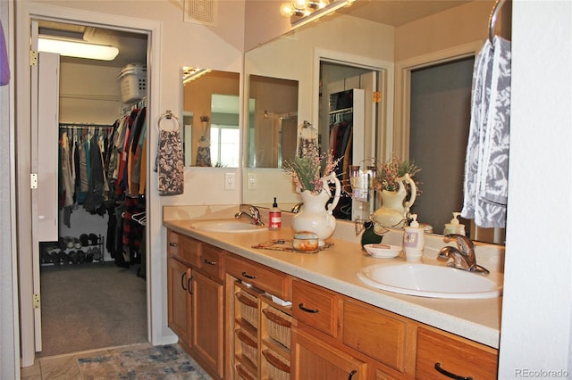7824 S Zante Ct, Aurora, CO 80016 - bathroom with double vanity and a spacious closet