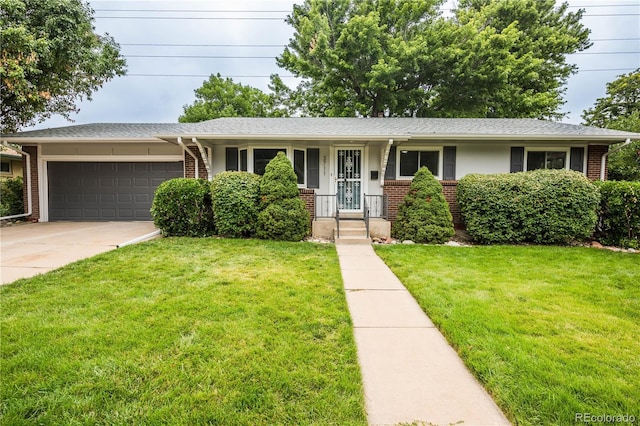 single story home featuring a garage and a front yard