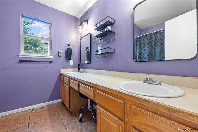 3032 Pony Tracks Dr, Colorado Springs, CO 80922 - bathroom with double vanity and tile patterned floors