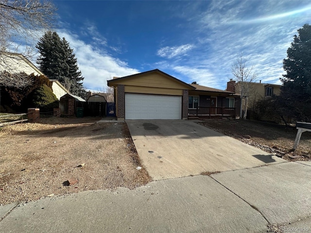 view of front of home featuring covered porch and a garage