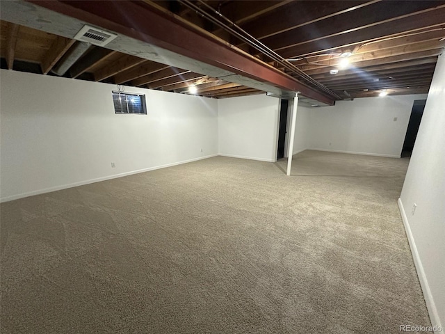 basement featuring carpet flooring