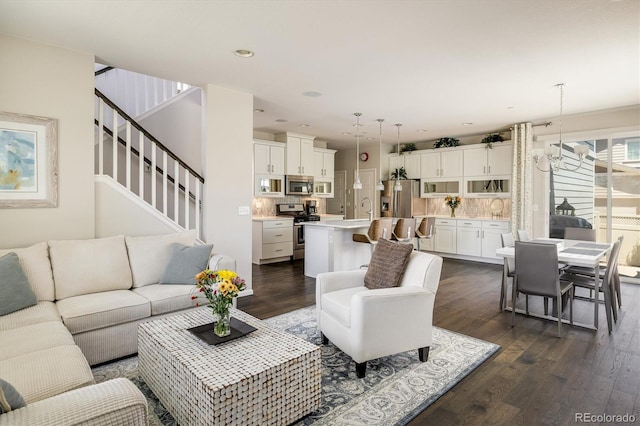5451 W 73rd Ave, Westminster, CO 80003 - living room with dark wood-type flooring, stairs, and recessed lighting