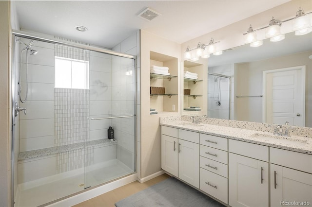 5451 W 73rd Ave, Westminster, CO 80003 - bathroom with a shower stall, double vanity, and wood finished floors