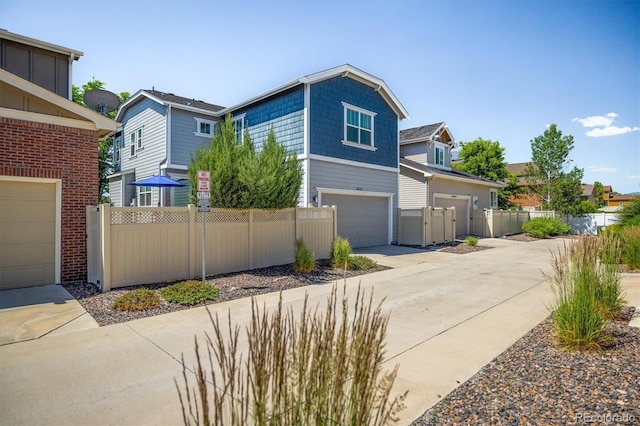 5451 W 73rd Ave, Westminster, CO 80003 - view of front of home with driveway and an attached garage