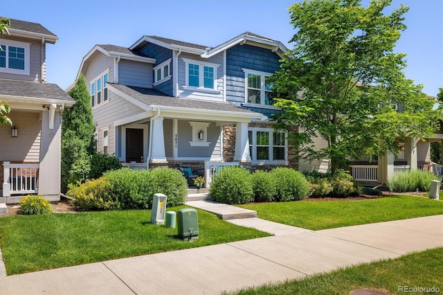 5451 W 73rd Ave, Westminster, CO 80003 - craftsman-style house with a porch and a front lawn