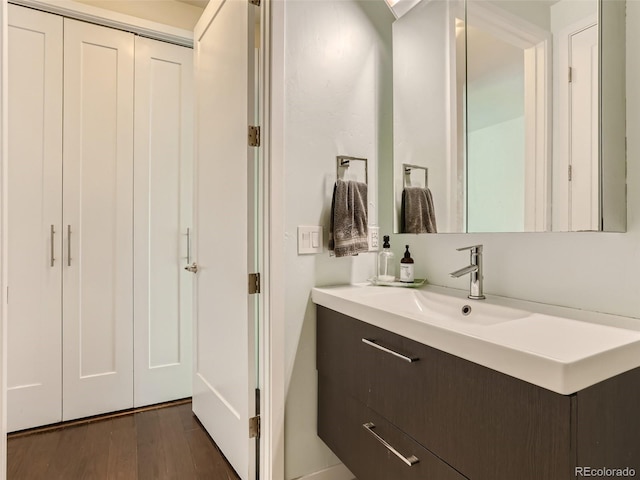 bathroom featuring vanity and wood-type flooring