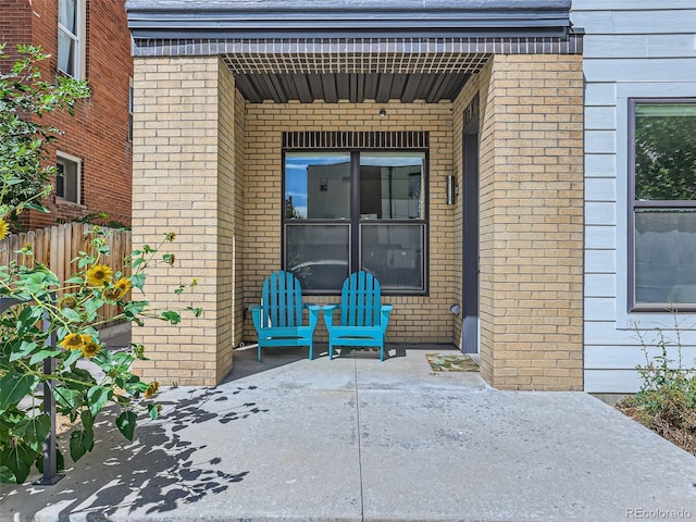 property entrance featuring a patio