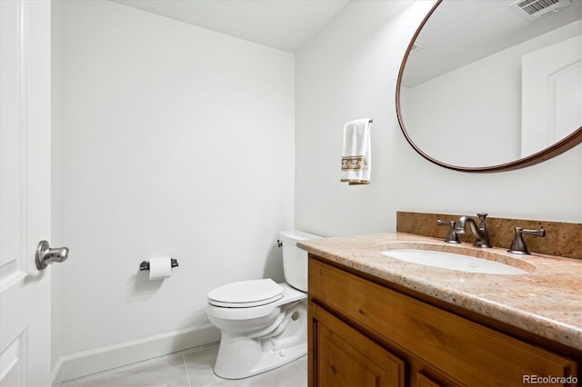 bathroom with visible vents, toilet, vanity, baseboards, and tile patterned floors