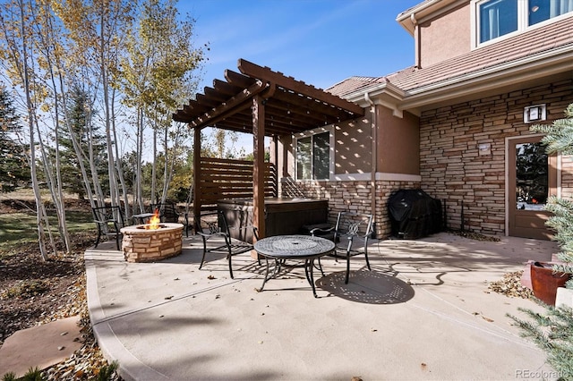 view of patio featuring an outdoor fire pit and a grill