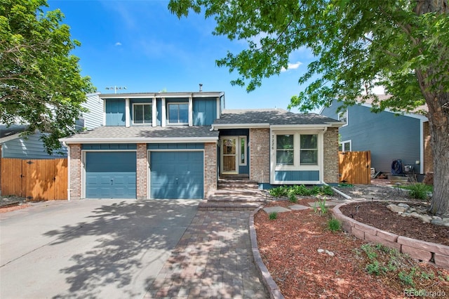 7226 S Eagles Nest Cir, Littleton, CO 80127 - tri-level home featuring a garage, concrete driveway, brick siding, and roof with shingles
