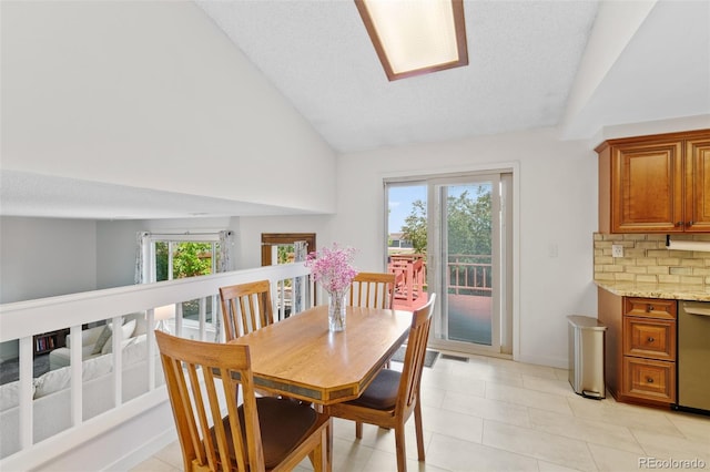 7226 S Eagles Nest Cir, Littleton, CO 80127 - dining room with light tile patterned floors and high vaulted ceiling