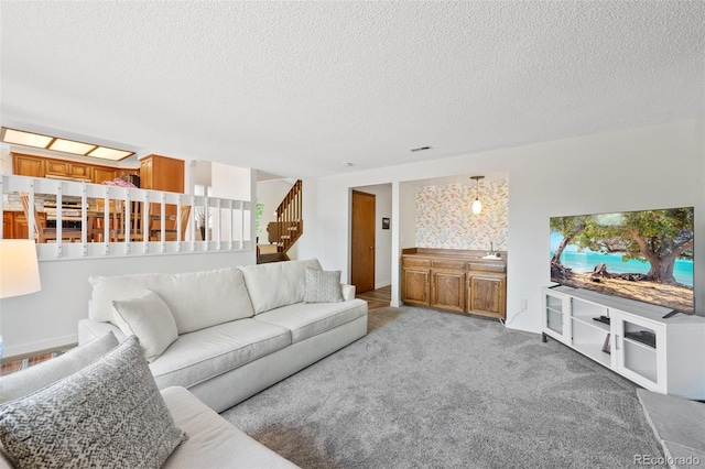 7226 S Eagles Nest Cir, Littleton, CO 80127 - living area featuring stairway, a textured ceiling, and light carpet