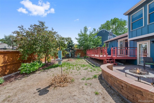 7226 S Eagles Nest Cir, Littleton, CO 80127 - view of yard featuring an outdoor fire pit, a wooden deck, and a patio