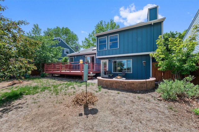 7226 S Eagles Nest Cir, Littleton, CO 80127 - rear view of property with board and batten siding and a wooden deck
