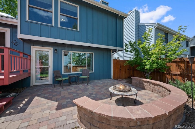 7226 S Eagles Nest Cir, Littleton, CO 80127 - view of patio / terrace featuring a fire pit and a deck