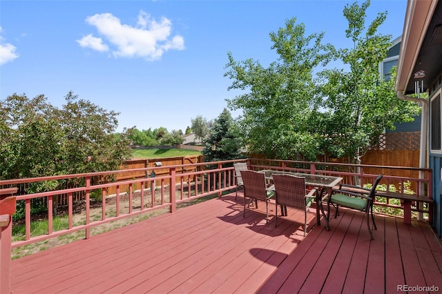 7226 S Eagles Nest Cir, Littleton, CO 80127 - wooden terrace featuring a fenced backyard and outdoor dining area