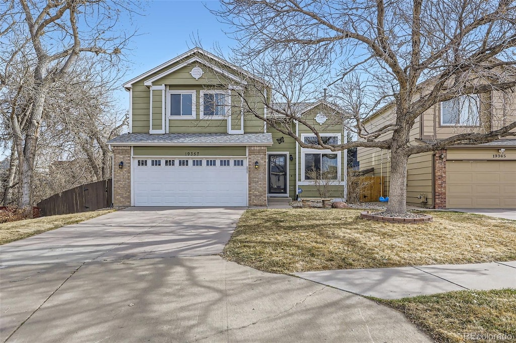 19357 E 40th Ave, Denver, CO 80249 - traditional-style home with roof with shingles, concrete driveway, fence, an attached garage, and brick siding