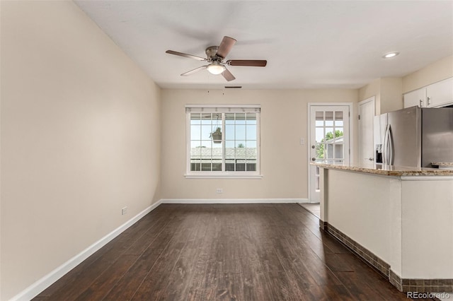 2301 E Fremont Ave Unit W08, Centennial, CO 80122 - unfurnished living room with ceiling fan and dark wood finished floors