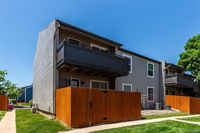2301 E Fremont Ave Unit W08, Centennial, CO 80122 - rear view of property with a balcony and stucco siding