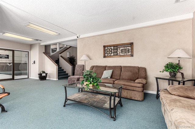 2301 E Fremont Ave Unit W08, Centennial, CO 80122 - living room with a textured ceiling, carpet floors, and stairs