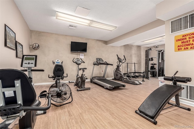 2301 E Fremont Ave Unit W08, Centennial, CO 80122 - exercise room featuring wood finished floors and baseboards