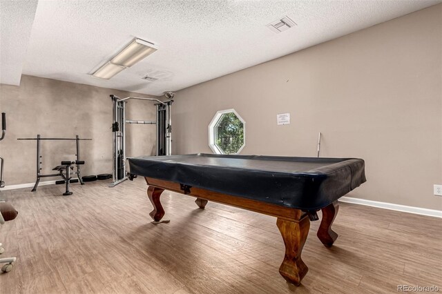 2301 E Fremont Ave Unit W08, Centennial, CO 80122 - playroom with pool table, wood finished floors, and a textured ceiling