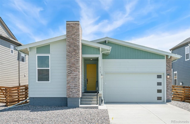 9360 Bahama Ct, Commerce City, CO 80022 - mid-century inspired home featuring a garage, driveway, and a chimney