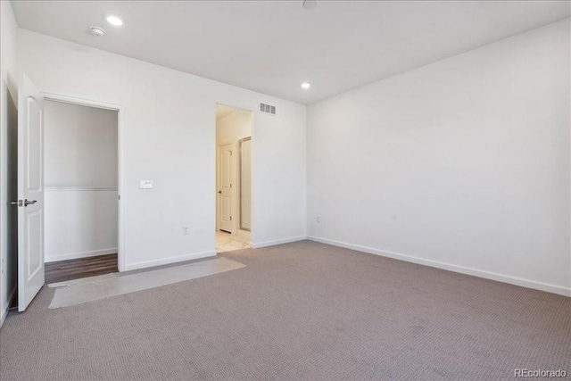 unfurnished bedroom featuring light colored carpet