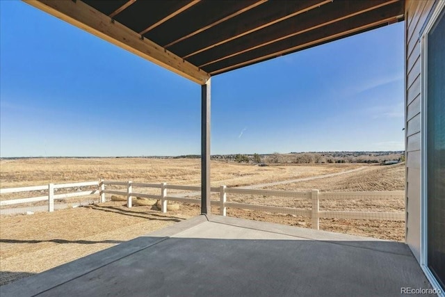 view of patio / terrace with a rural view