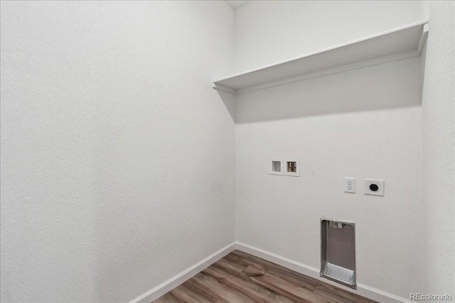 laundry room featuring electric dryer hookup, dark hardwood / wood-style flooring, and hookup for a washing machine