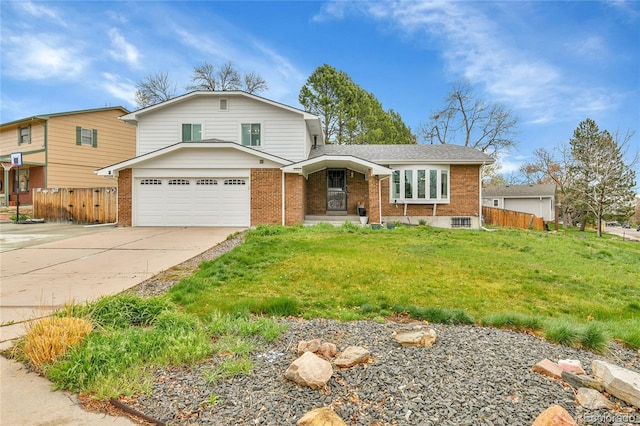7796 S Marshall Ct, Littleton, CO 80128 - view of front of property with brick siding, a garage, and driveway