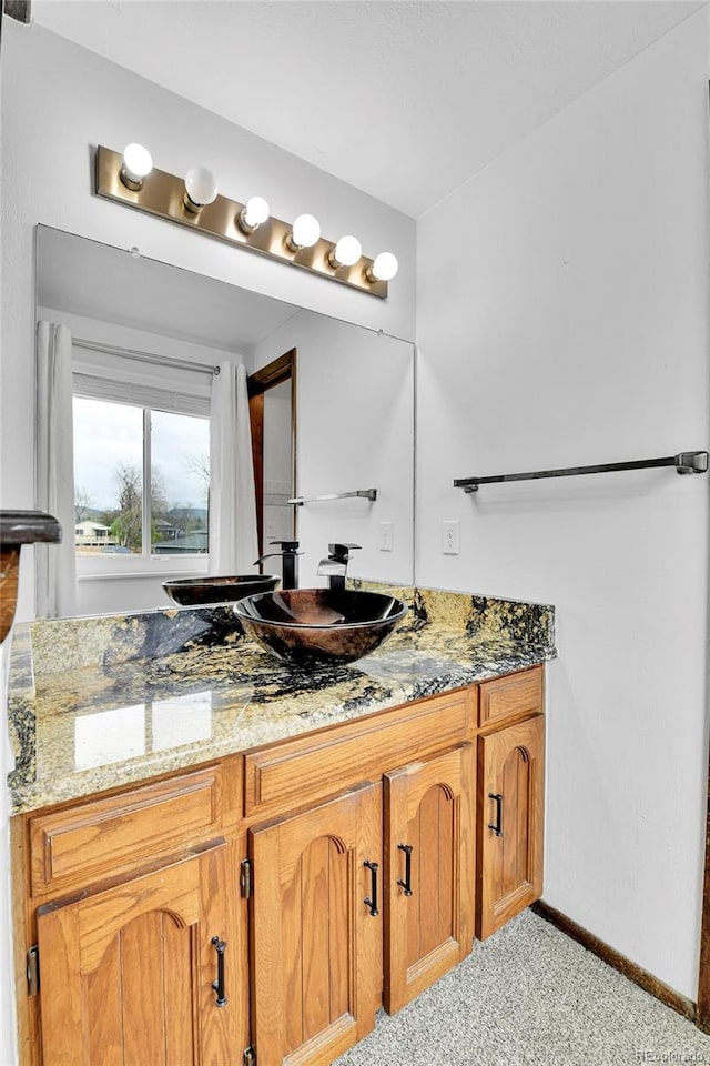 7796 S Marshall Ct, Littleton, CO 80128 - bathroom with baseboards and vanity