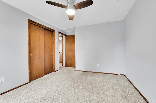 7796 S Marshall Ct, Littleton, CO 80128 - unfurnished bedroom featuring carpet, a closet, baseboards, and ceiling fan