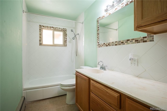 full bathroom featuring baseboard heating, toilet, decorative backsplash, vanity, and bathtub / shower combination